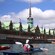 Kayakers paddle on a canal next to old buildings in Copenhagen, Denmark